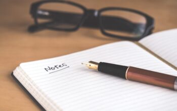 brown fountain pen on notebook
